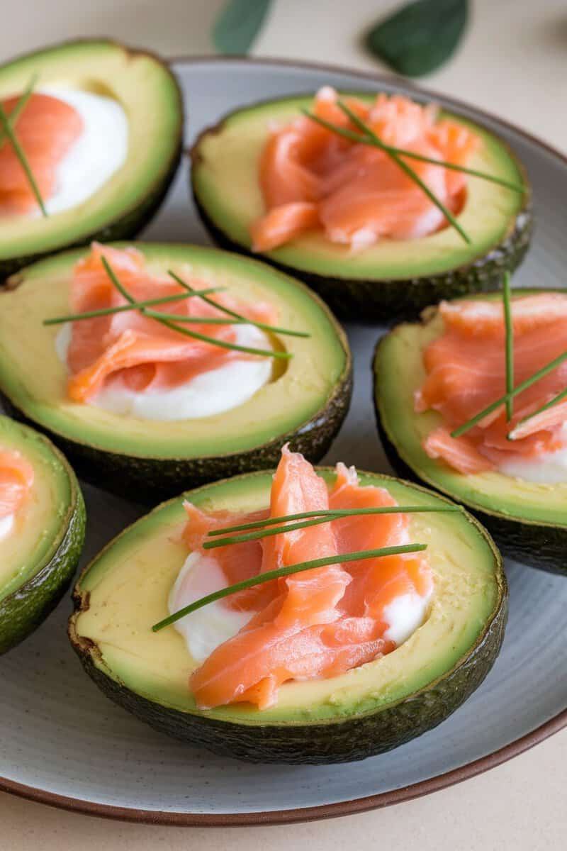 Baked avocado eggs topped with smoked salmon and chives