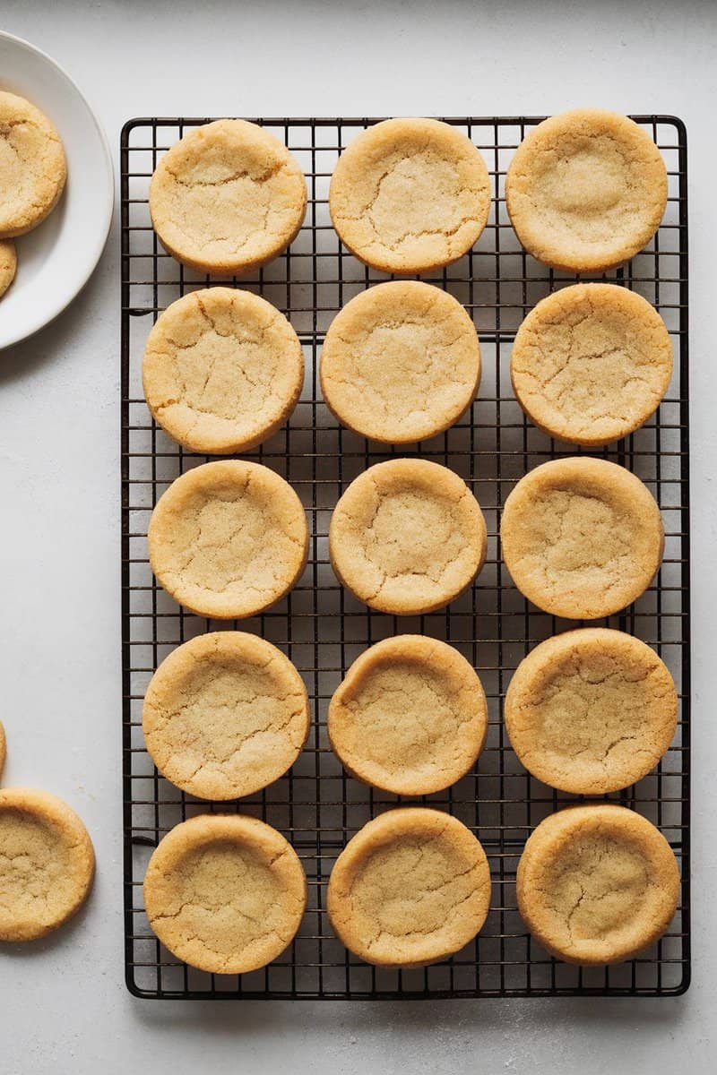 Delicious sugar cookies cooling on a wire rack.