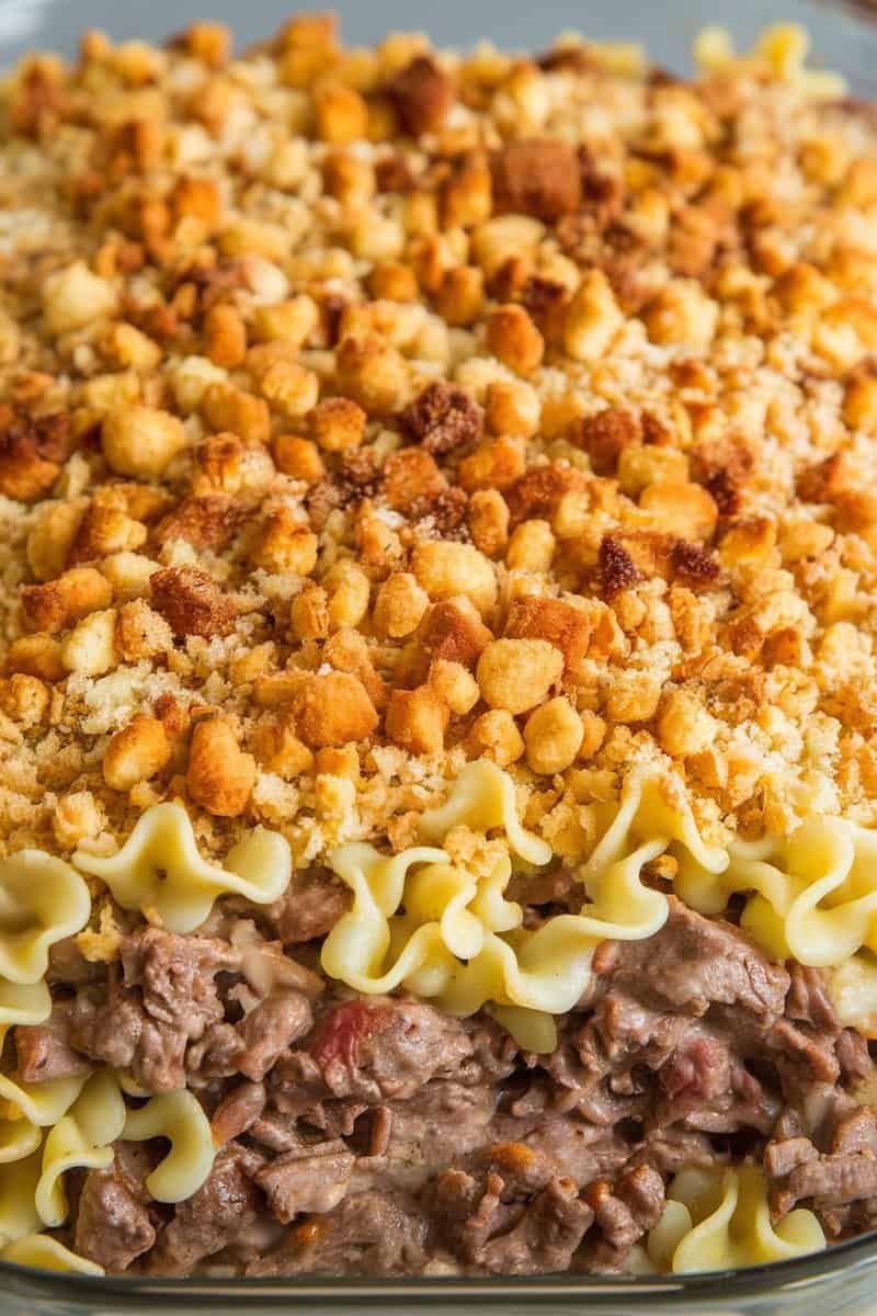 A delicious beefy noodle casserole topped with crispy breadcrumbs.