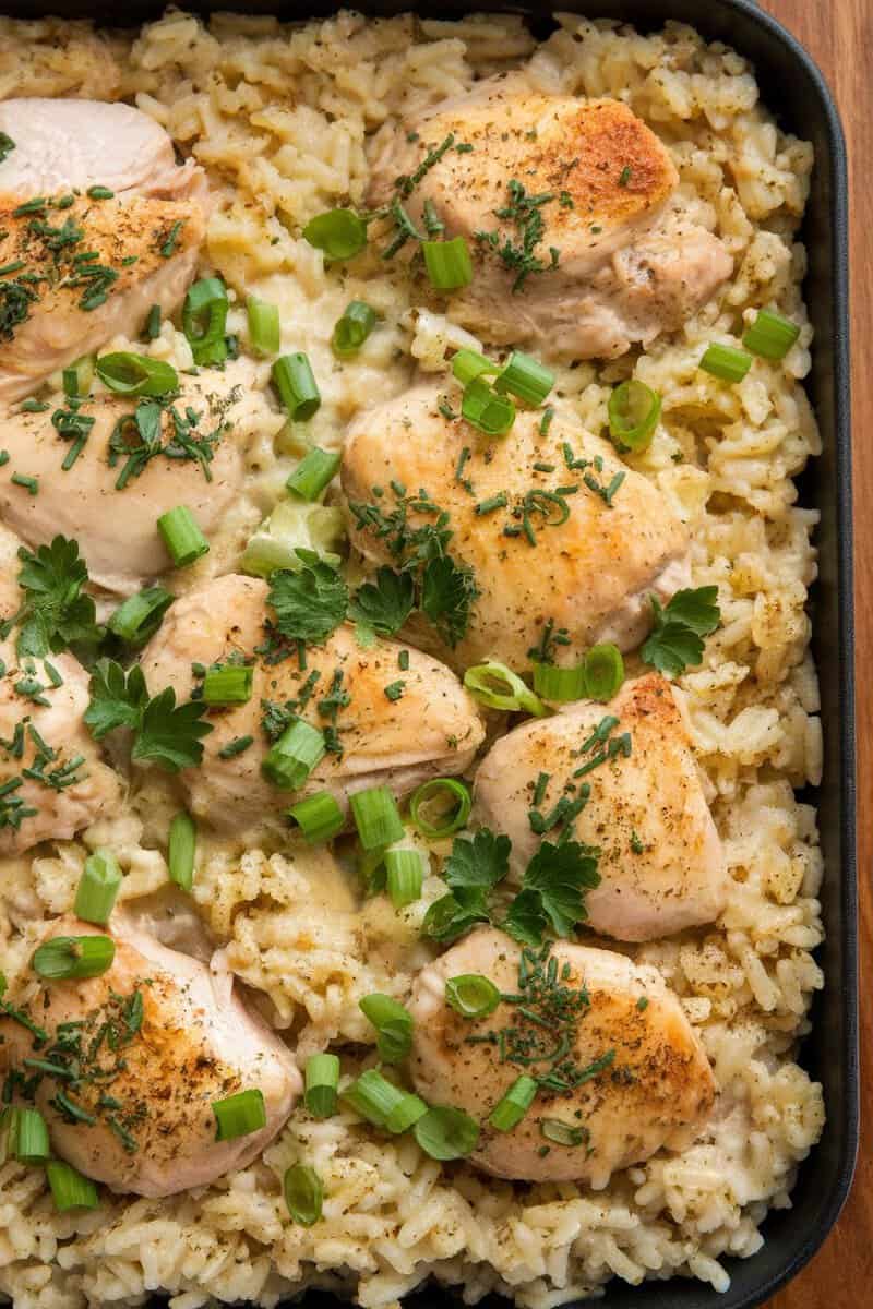 A delicious chicken and rice casserole topped with herbs and green onions