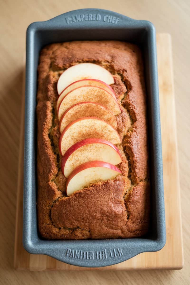 Deliciously baked spiced apple cider loaf with apple slices on top