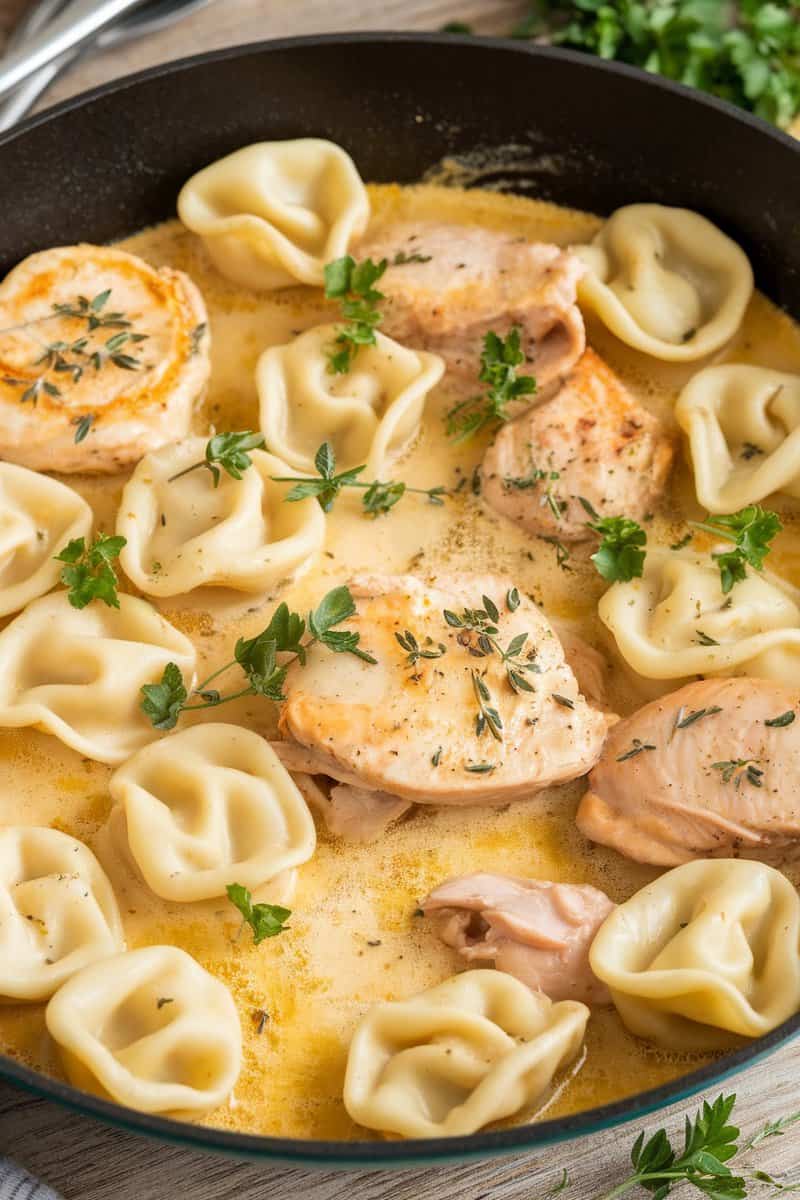 A delicious serving of Lemon Garlic Butter Chicken Tortellini in a skillet